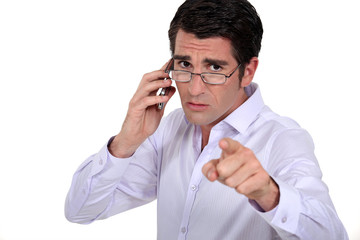 A boss blaming one of his employee.