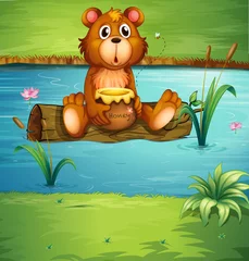 Tuinposter Een beer zittend op een droog hout © GraphicsRF