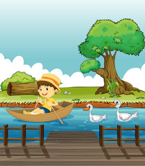 Un garçon montant sur un bateau suivi de canards