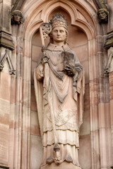 Stone sculpture of priest