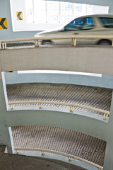 Fototapeta premium Car driving out of car park building