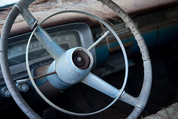 Fototapeta na wymiar Automobile old steering wheel and dash