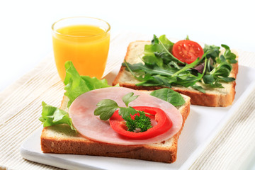 Bread with ham and salad greens
