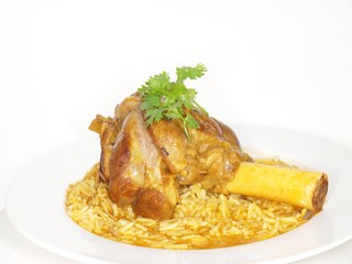 Lamb shank in juicy yellow rice