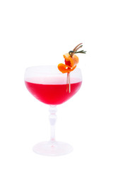 Red cocktail decorated with raspberries in orange skin
