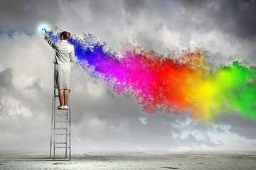 Young woman drawing splashes
