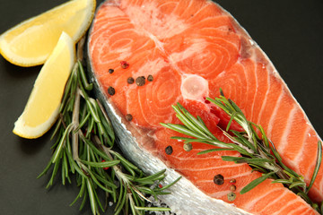 Fresh salmon steak on pan, close up
