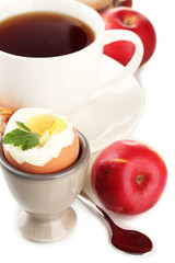 Light breakfast with boiled egg and cup of coffee, isolated