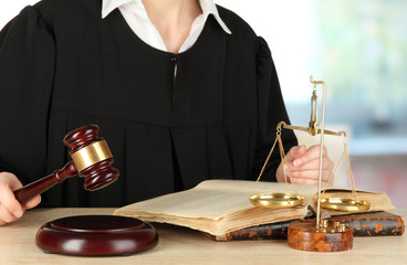 Judge sitting at table during court hearings on room background