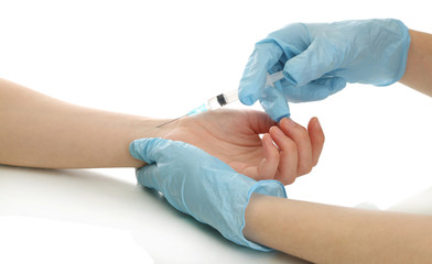 Fototapeta premium Doctor holding syringe with a vaccine in the patient hand,