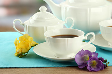 Beautiful tea service on wooden table