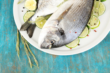 Two fish dorado with lemon