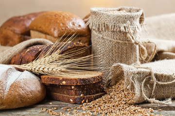 Plakat fresh bread and wheat on the wooden