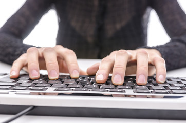 Closeup of a business woman typing on keyboard