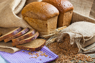 fresh bread and wheat on the wooden