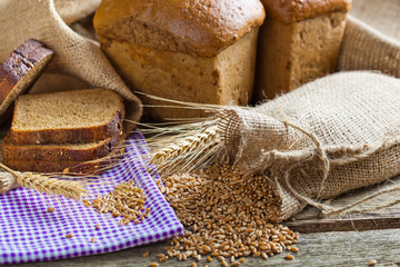 fresh bread and wheat on the wooden