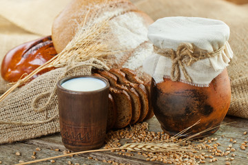 fresh bread and wheat on the wooden