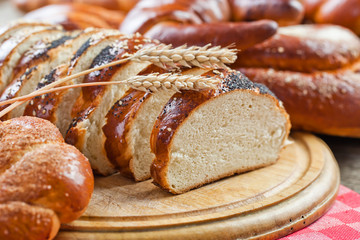 fresh bread and wheat on the wooden
