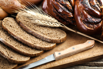 fresh bread and wheat on the wooden