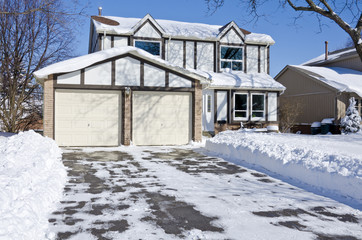 House in the Suburb After Heavy Snow