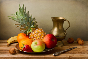 Still life with assorted fruits on wooden table