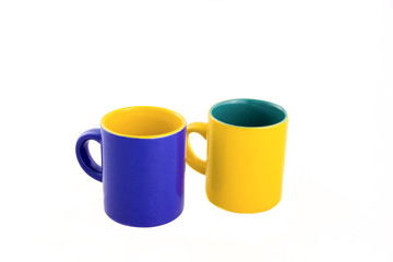 two cups near each other - yellow and blue