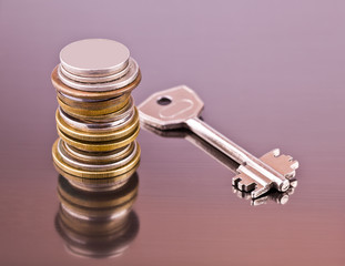 Stack of coins and key