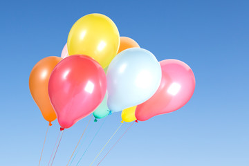 Bunch of colorful balloons in the blue sky