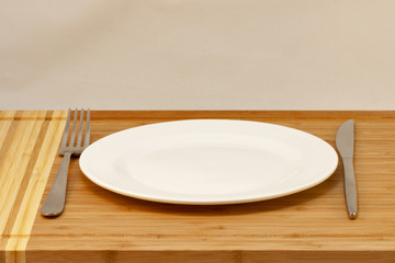 cutlery empty plate, table knife and fork