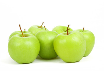 seven green apples isolated on a white background