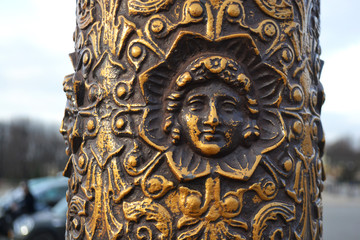 Detail of a street lamp - bas, Paris, France