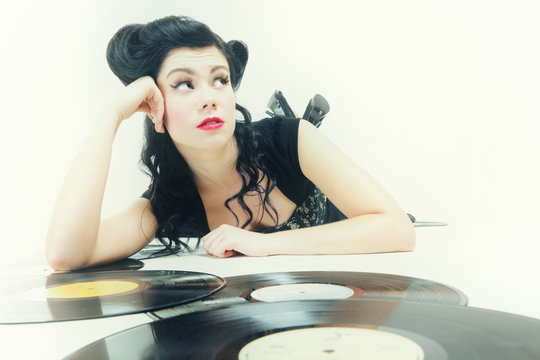 Sexy girl with phonography analogue record music lover