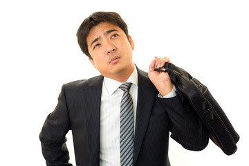 疲れた表情のビジネスマン