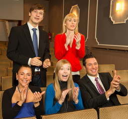 Theatre audience clapping and cheering