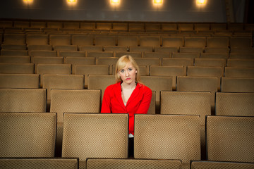 Solitary woman in a theatre