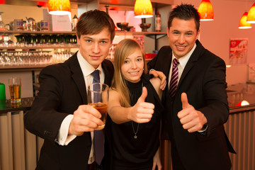 Three friends in a bar