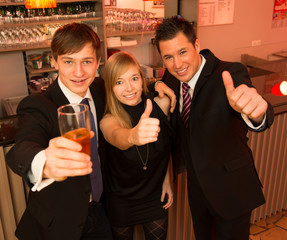 Three friends in a bar