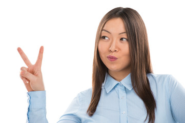 Portrait of confident young business woman showing victory gestu