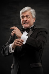 Portrait of a mature business man looking depressed from work ov