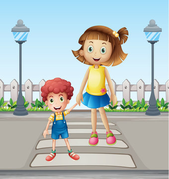 A little child and a girl crossing the pedestrian