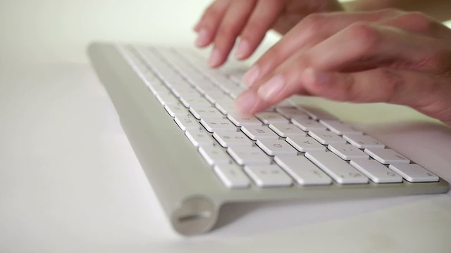 finers type on silver keyboard