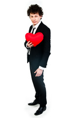 a young man with a red plush heart