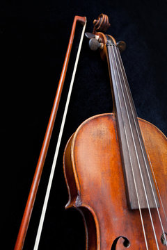 violin and bow on black background