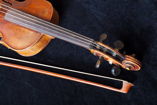 fiddle pegbox and bow on black velvet