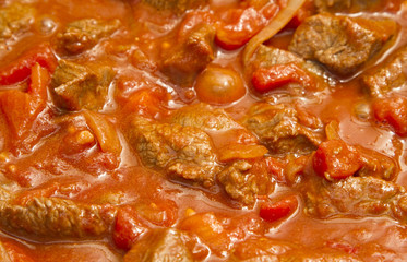Beef goulash cooking in a pan