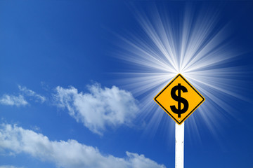 Yellow Rhombus Road Sign With Dollar Sign Inside On Blue Sky Bac