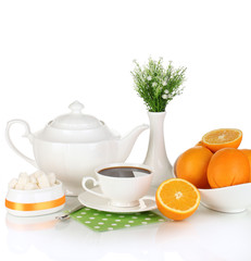 Beautiful white dinner service with oranges isolated on white