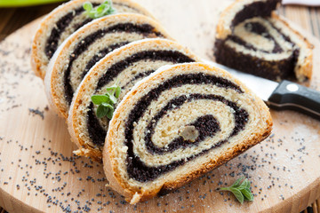 poppy seed Roll on a wooden surface