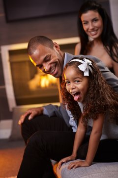 Happy diverse family having fun at home