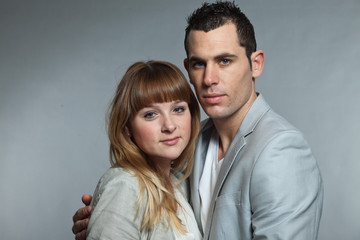 Young couple man and woman in love. Studio shot.